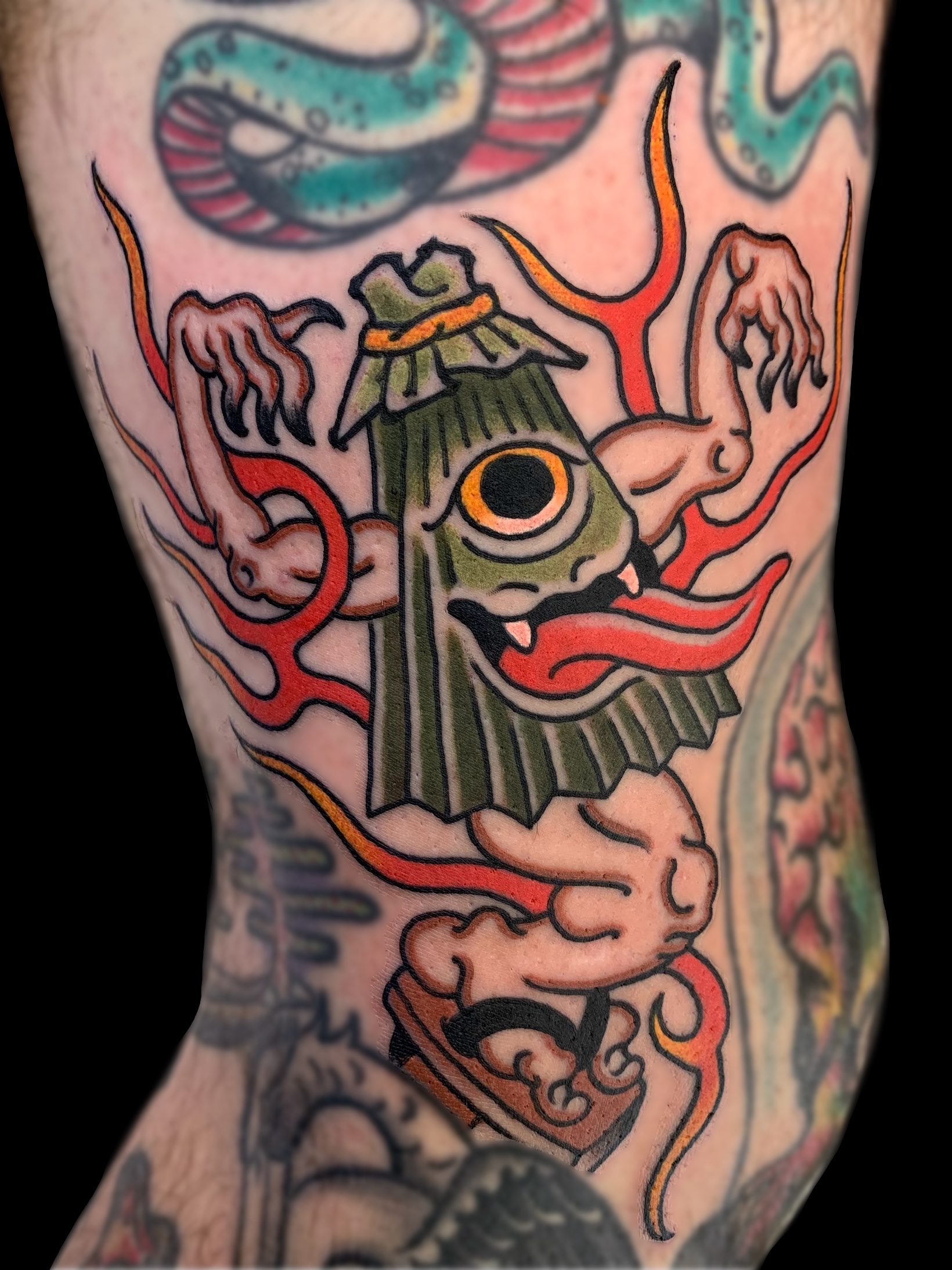 Traditional Japanese kasa-obake umbrella yokai leg tattoo