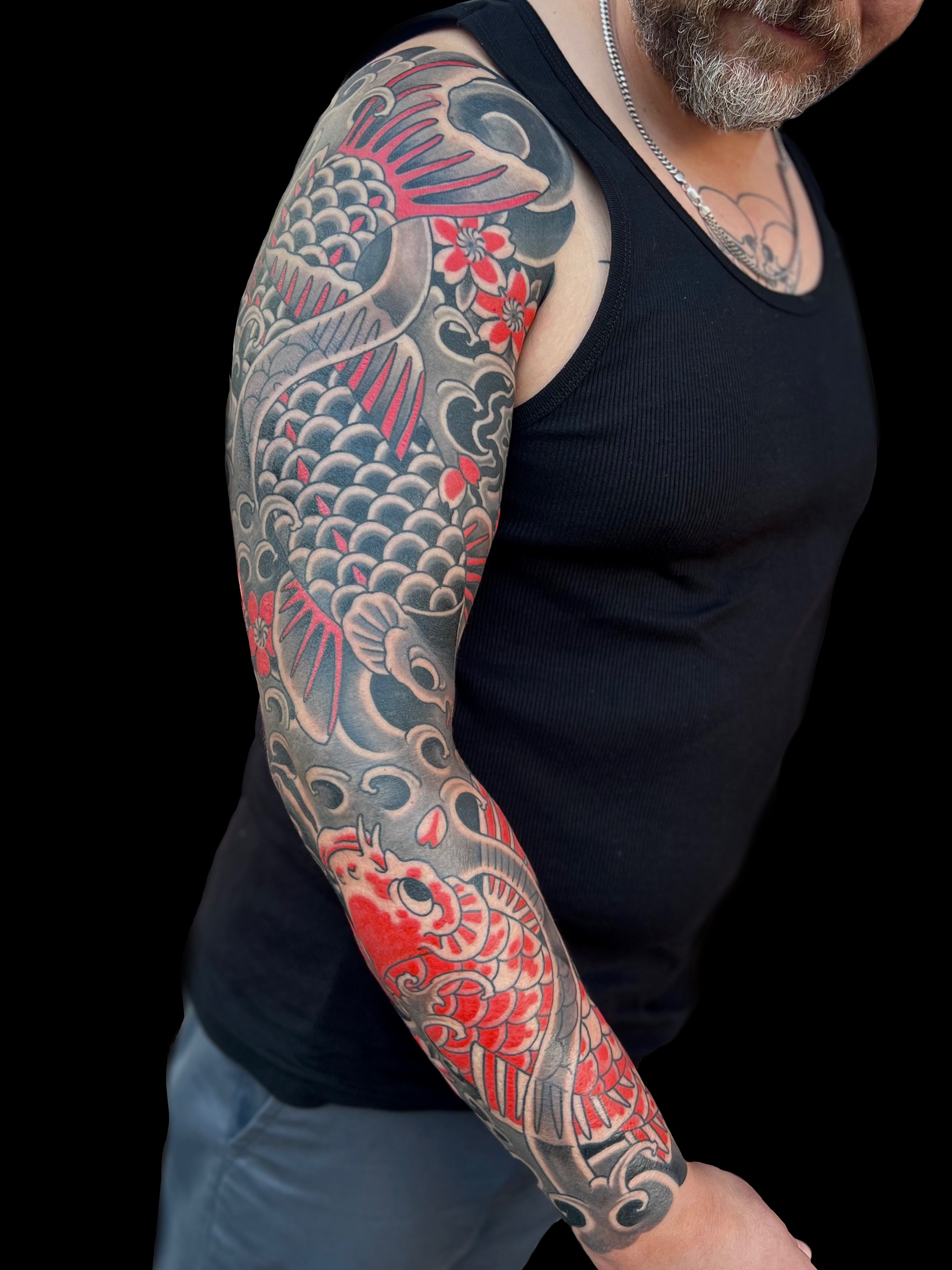 Traditional Japanese black and red koi and cherry blossom full sleeve tattoo