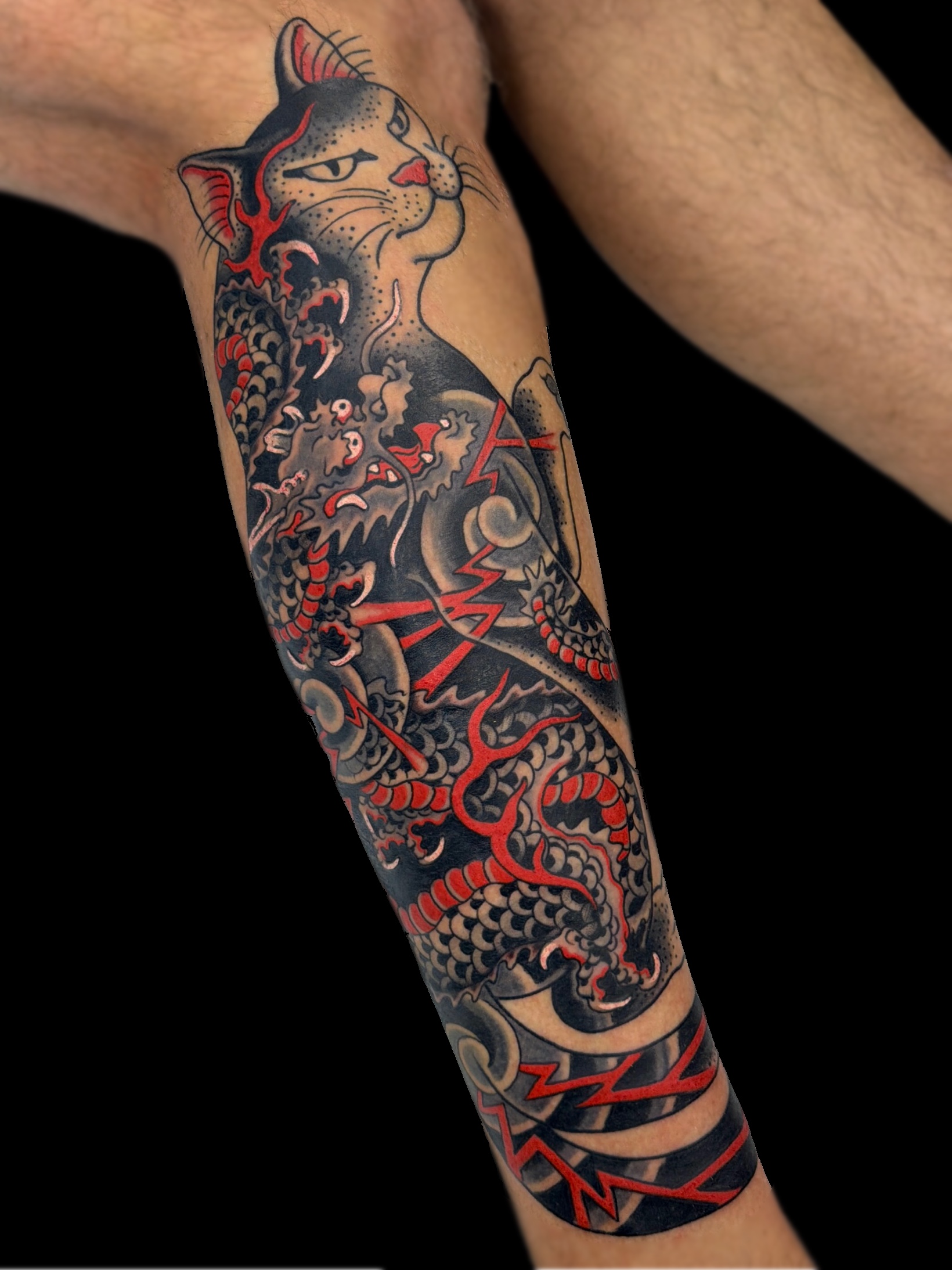 Traditional Japanese mon mon cat dragon and lightning leg tattoo