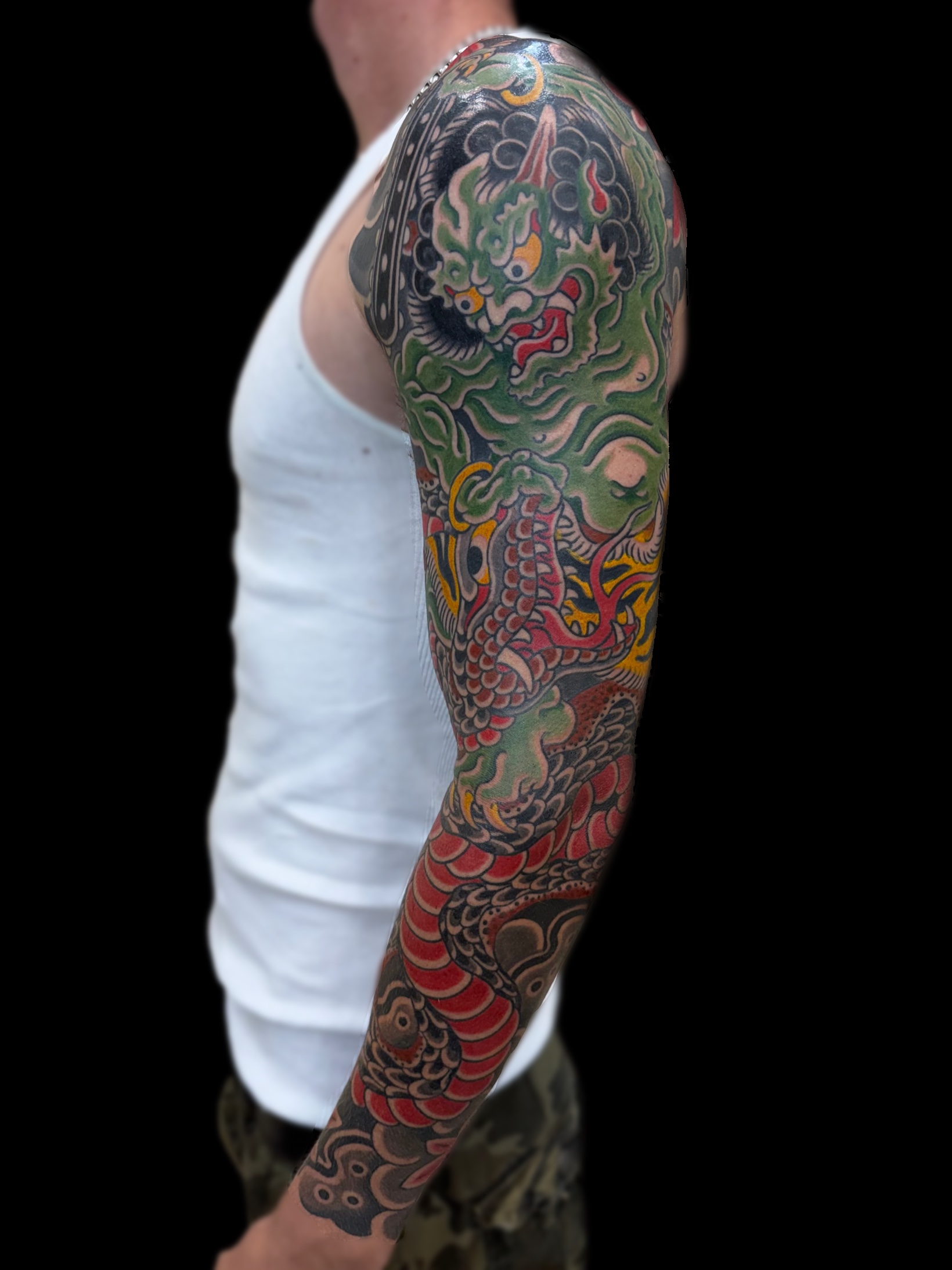 Traditional Japanese Oni fighting a snake full sleeve tattoo