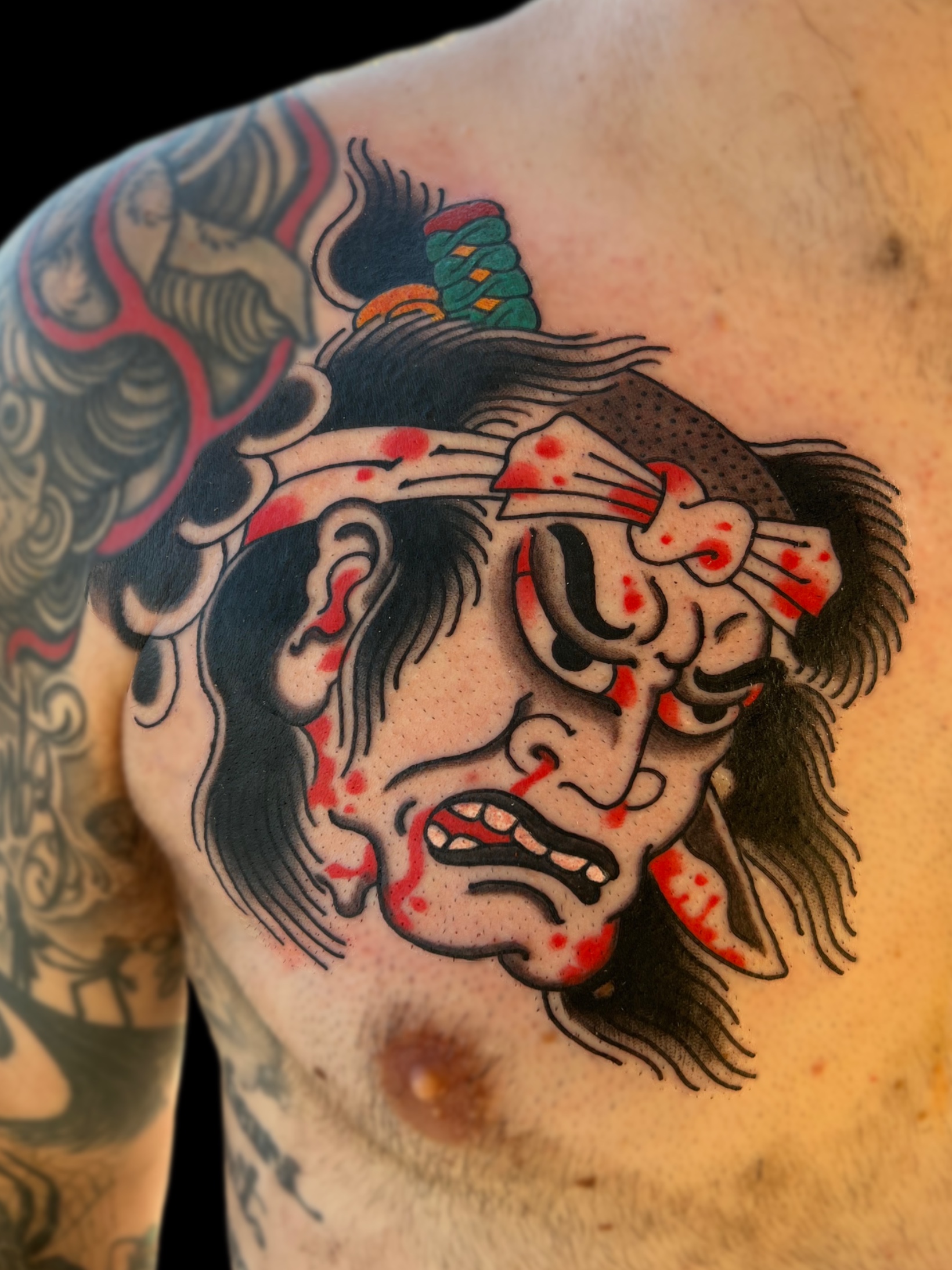Japanese traditional namakubi severed head chest tattoo