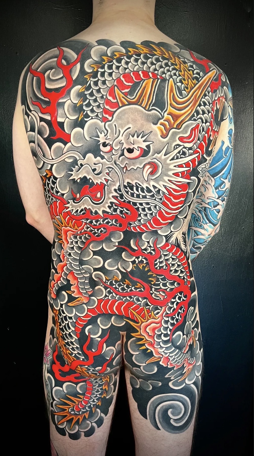 Chopper tattooing a traditional Japanese piece in St. Petersburg FL